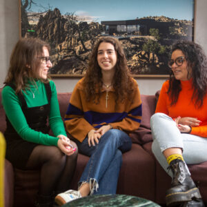 Three Global Lingo employees sitting on the sofa