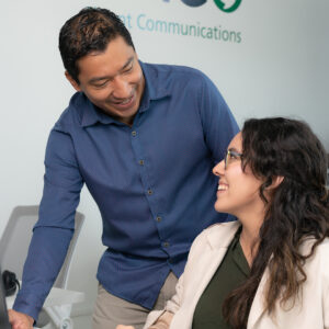 Two Employees working and smiling