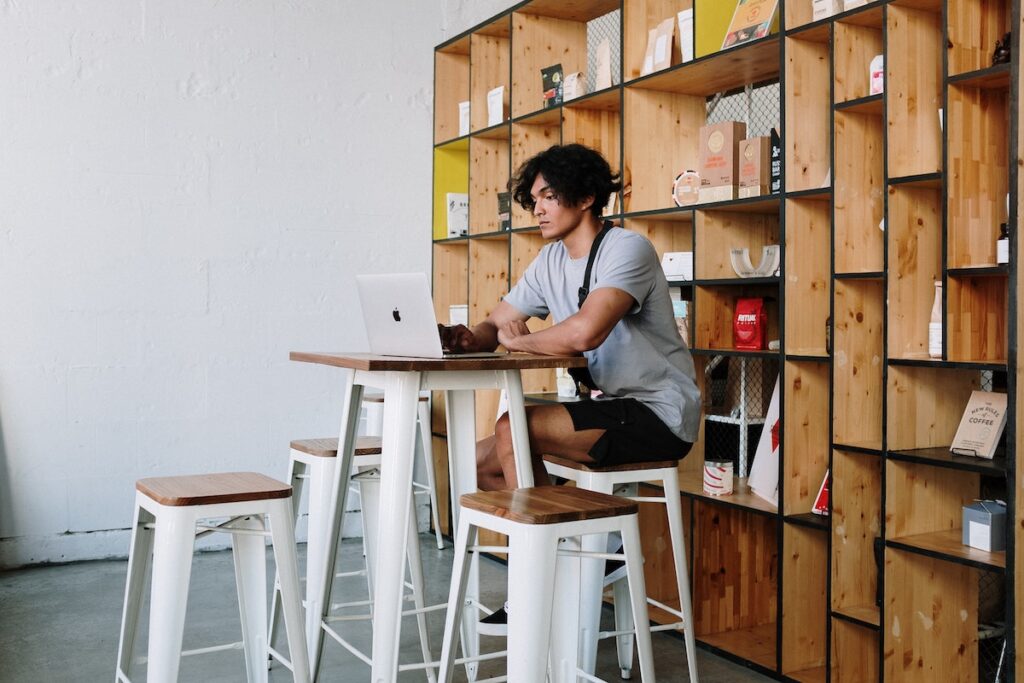 Student sitting at his desk reviewing an elearning course.