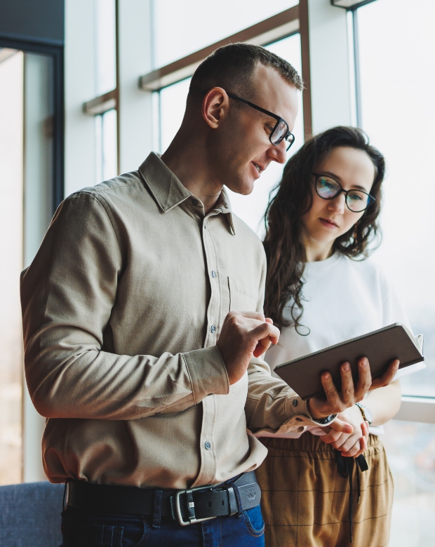 Professional specialists working together in a shared office environment, illustrating high-quality translation services. Bulgarian Language Services