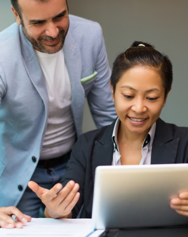 Focused colleagues working on a shared project, illustrating Khmer language and business support