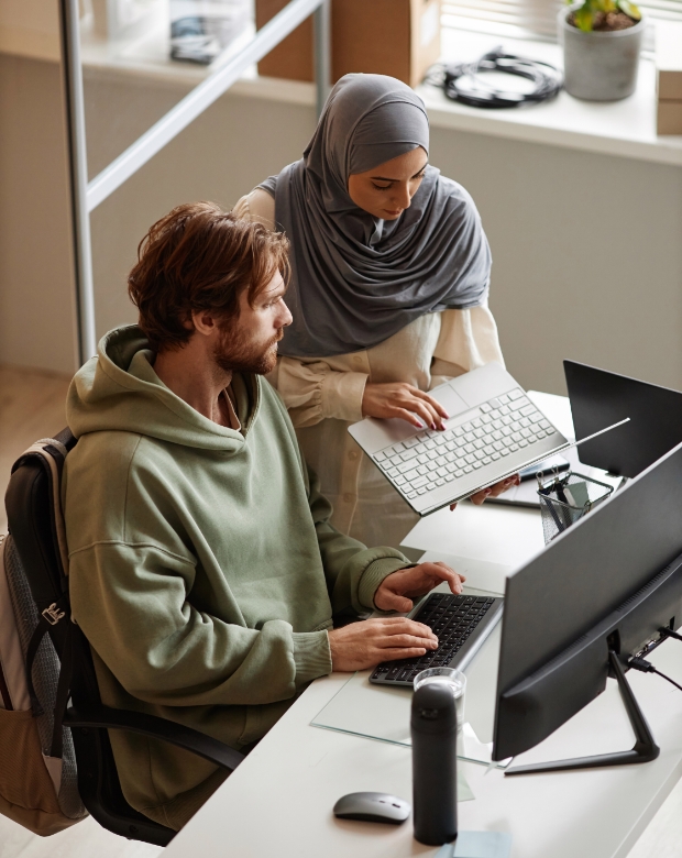 Team members engaging in a strategic discussion, symbolizing Malay translation and localization