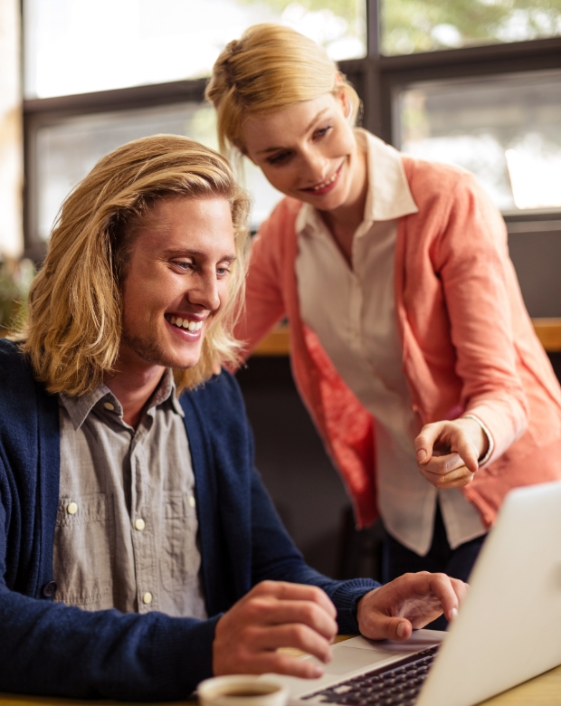 Professional duo reviewing technical documents, representing Swedish linguistic and business solutions