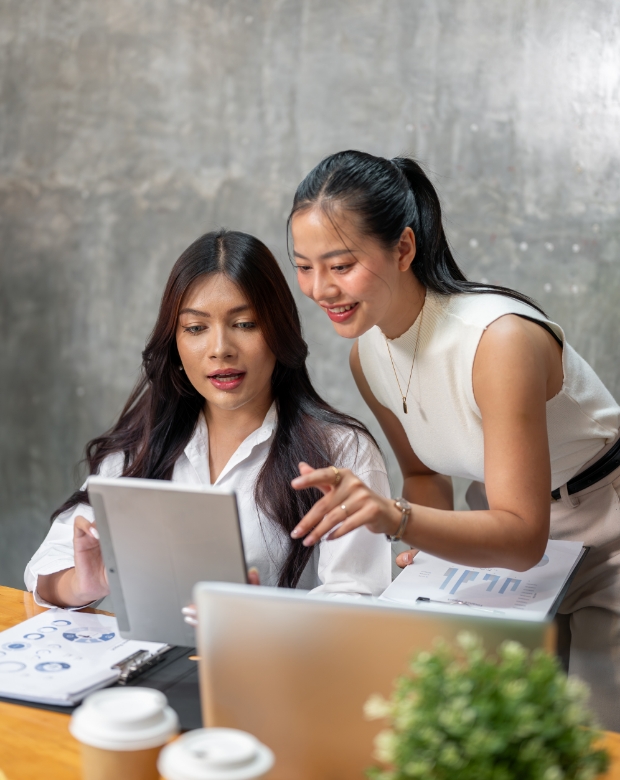 Focused team members discussing project details, illustrating Tagalog language and business support