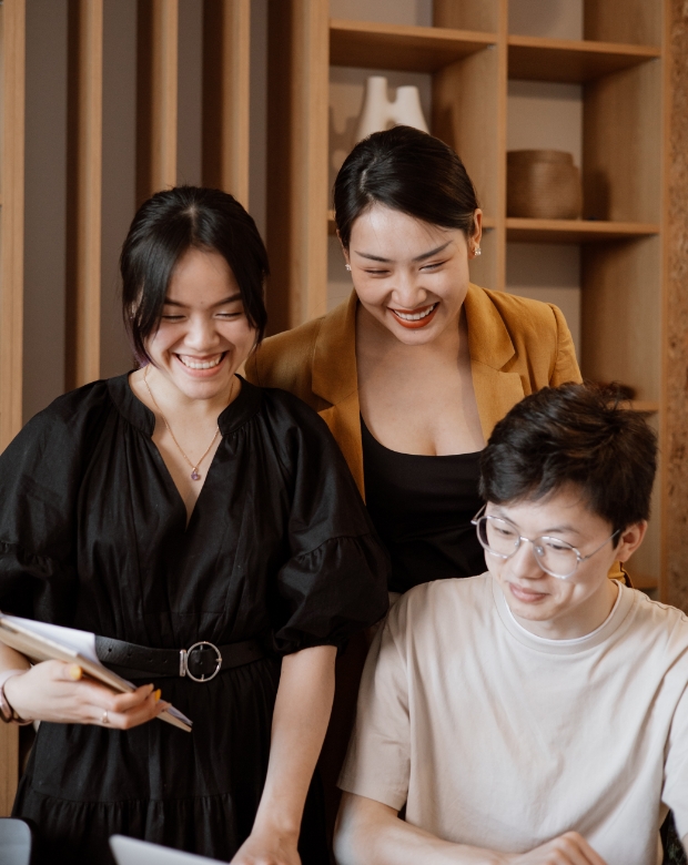 Corporate team collaborating in a bright office, representing Thai localization and interpreting