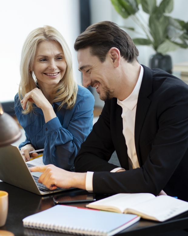 Focused business professionals reviewing documents, symbolizing Serbian language solutions