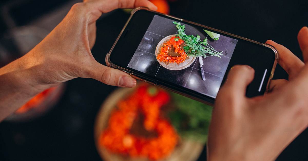Someone taking a photo of their meal