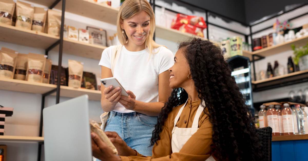 Two shoppers reading a product label in a grocery store, representing informed consumer decisions and retail brand communication
