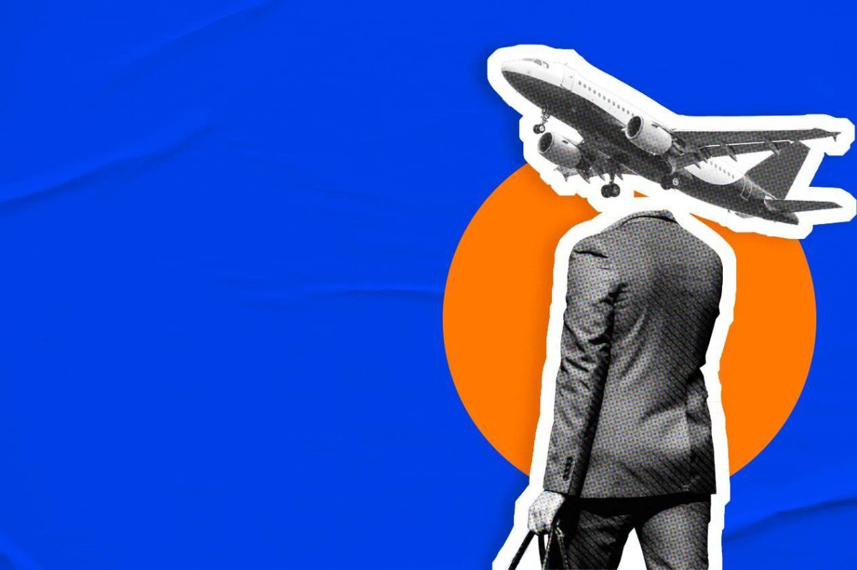A suited business traveler walks with a briefcase as a commercial airplane takes off overhead, illustrating current trends in travel and tourism and the global movement of modern professionals.