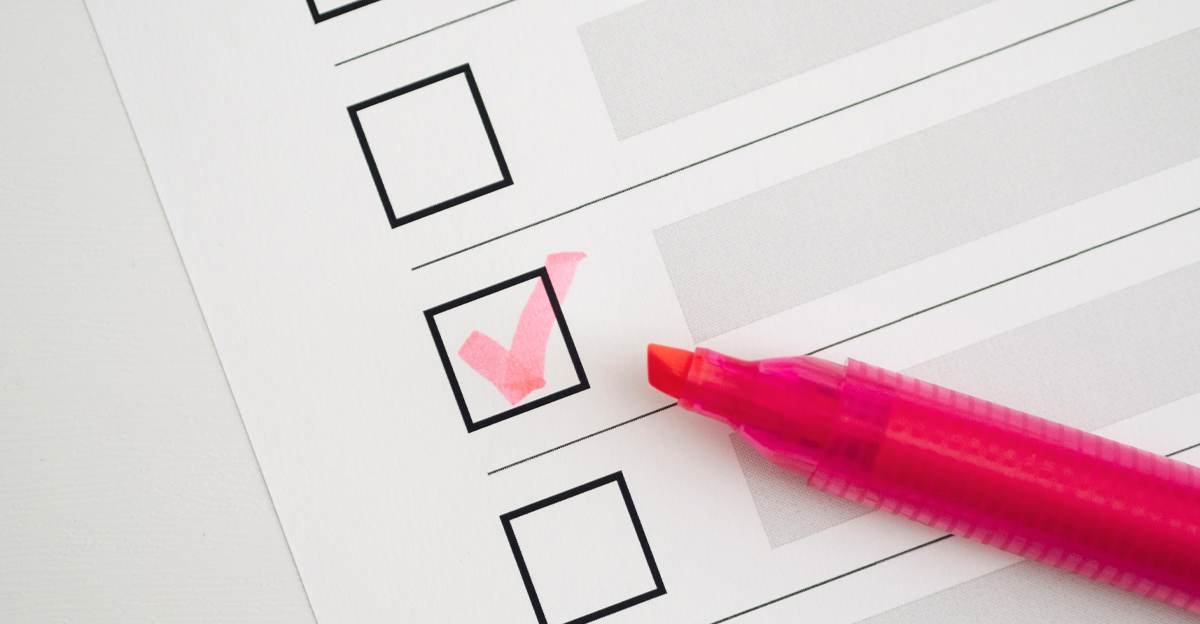 A pink highlighter marking a checkbox on a printed checklist